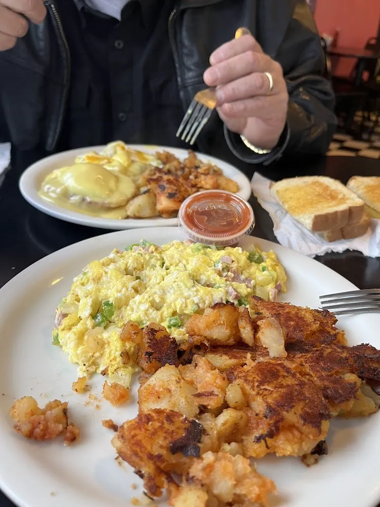 1 Egg 1 Bacon or 1 Sausage Your Choice of Home Fries or Hash Browns and 1 Slice of Toast